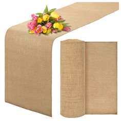 a table runner with tulips on it and burlock around the edge