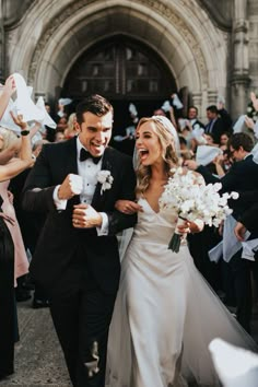 a newly married couple walking through confetti