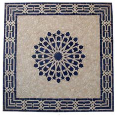 a blue and white rug with an intricate design on the bottom, in front of a white background