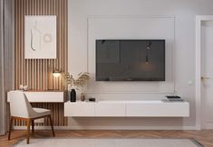 a living room with a large flat screen tv mounted to the side of a wall