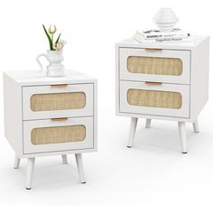 two white side tables with wicker drawers and one has a vase on top of it