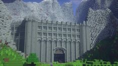 an image of a large building made out of lego blocks with mountains in the background