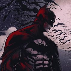 a man in a red cape standing next to a tree with bats flying around it