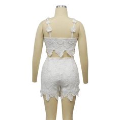 Indulge in luxury with our Feminine Lace Applique' Shorts Set. Featuring delicate lace appliques, this set exudes elegance and sophistication. Perfect for a romantic evening or a special occasion, this set will make you feel confident and stylish. Elevate your wardrobe with this exclusive piece. Sizes S-2XL Decoration Zip Up , Lace Length Above Knee, Mini Style Sexy & Club Fabric Type Blended fabrics , Lace Material Polyester , Spandex Neckline Strappy Pattern Type Solid Sleeve Length Sleeveless Fitted Sleeveless Lace Set, White Lace Party Set, Feminine Fitted Sets With Lace Trim, Elegant Spring Lace Top, Elegant Lace Set For Wedding Night, White Lace Feminine Sets, Feminine Two-piece Party Sets, Elegant Lace Sets For Spring, Summer Party Lace Sets