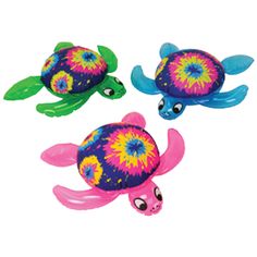 three plastic sea turtle toys in the shape of small turtles with colorful hair and eyes