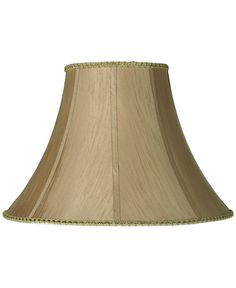 a beige lamp shade with beading on the bottom and side of the lampshade