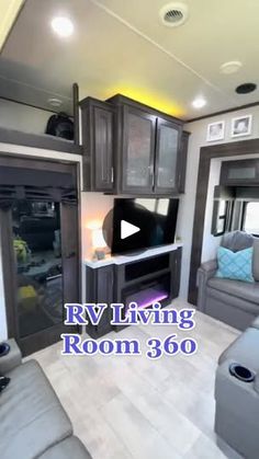 an rv living room with gray couches and cabinets