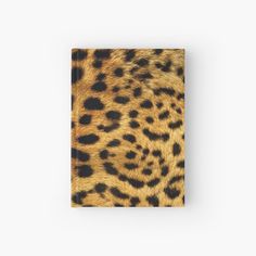 an animal print book with black and brown spots