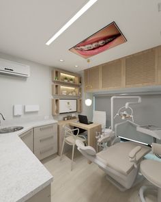 a dental room with chairs, desks and shelves on the wall next to an open sink