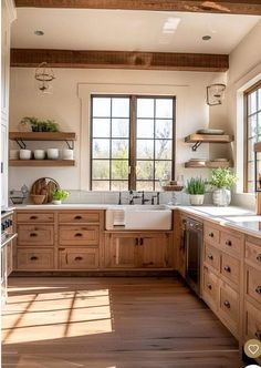 a large kitchen with wooden cabinets and white counter tops, along with open windows that look out onto the outdoors