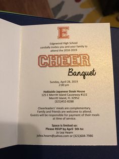 an open brochure with the words cheer banquet written in orange and gold on it