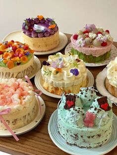 there are many different cakes on the table