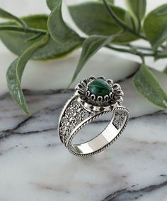 This lovely Filigree Cocktail Ring is made of 925 sterling silver and has a lovely daisy pattern. The front of the dainty ring features malachite gemstone is cabochon round cut gemstone, which lends a unique touch to this piece. This ring is appropriate for daily wear as well as special occasions such as date night or a wedding anniversary.  This product can also be used as an anniversary gift, Christmas gift, mother's day gift, thanksgiving gift (November 21-25), or birthday gift. This sterling silver ring is a great addition to your accessories collection because it is both elegant and lovely. This ring is made of high-quality sterling silver and has a green stone gemstone. It has an attractive filigree design.  It is available in sizes 5 to 12.5 with half sizes to provide a precise fit. Classic Gemstone Flower Ring For Gift, May Birthstone Filigree Ring Gift, Filigree Ring For May Birthstone Gift, Vintage Sterling Silver Emerald Ring As Gift, Sterling Silver Filigree Ring With Gemstone For Gift, Unique Silver Filigree Ring Gift, Luxury Silver Filigree Ring With Gemstone, Green Sterling Silver Filigree Ring, Luxury Handmade Silver Filigree Ring