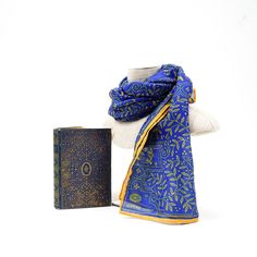 Royal blue is matched with gilt gold to produce an elegant design of detailed line-work. Let others revel at your royal scarf, as you relish the rightful admiration over your fine fashion taste. Inspiration: Poetical Works of Byron, c.1900 Classic Gold Silk Scarf, Elegant Ceremonial Shawl, Blue Silk Dupatta For Formal Occasions, Formal Blue Silk Dupatta, Elegant Gold Dupatta, Elegant Blue Silk Dupatta, Elegant Gold Dupatta As Gift, Traditional Gold Silk Scarves, Classic Gold Silk Scarf For Formal Occasions