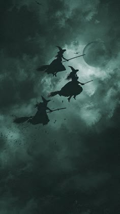 three witches flying in the sky at night