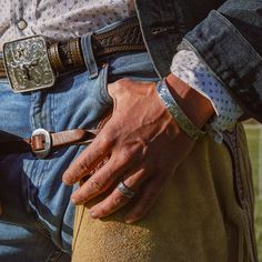 Our Gentleman's Cuff features a handsomely engraved 1/2" sterling silver band. Designed tough to keep up with the working man, this cuff is available with or without a fully lined 3/16" band of copper on the inside and measures 6 1/8" (inside) from end to end. With Copper Lining 114-901 Without Copper Lining 114-905 Pictured with The Johnny Bones Sterling Silver Cufflinks, The L.O.D.O. Buckle Set, and The Sterling Silver Boss Babe. All Vogt sterling items come with the Vogt Family's Unconditiona