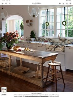 the kitchen is clean and ready to be used as a dining room or breakfast nook