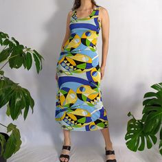 "Vintage maxi dress. Amazing miro pattern (blue, yellow, white, green & black) all over with a scoop neckline in the front & square back. The fabric has lots of stretch to it. Made in the 1990s (based on tag photographed). Very 1960s style. Made in USA. size- small/medium chest- 28\"- 38\" waist- 26\"- 34\" hip- 35\"- 44\" length (shoulder to hem)- 48\" fabric content- polyester, lycra" Peignoir Sets, 1960s Style, Blue Print Dress, Retro 60s, Maxi Robes, Vintage Maxi Dress, 1960s Fashion, The 1990s, Dress Clothes For Women