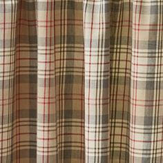 a close up view of a curtain with a plaid pattern on the top and bottom