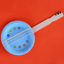 a blue frisbee sitting on top of a red table next to a toothbrush