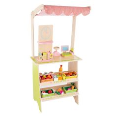 a doll house kitchen with food and accessories