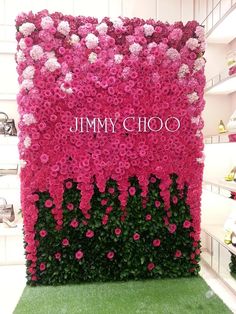 the jimmy choo sign is covered in pink flowers