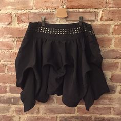 Beautiful Pinned And Studded Black Mini Skirt. Make A Statement At Your Next Party! New With Tags. Summer Evening Ruffled Mini Skirt, Chic Ruffled Skort For Party, Edgy Tiered Skirt For Party, Edgy Tiered Party Skirt, Edgy Flared Mini Skirt For Night Out, Chic Party Skort With Flowy Skirt, Chic Flowy Skort For Party, Asymmetrical Flowy Skort For Party, Chic Party Skort With Tiered Skirt