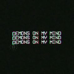 the words demons on my mind are lit up in the dark