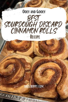 some cinnamon rolls sitting on top of each other in a pan with the words best sourdough dessert cinnamon rolls recipe