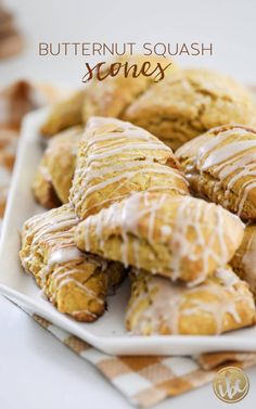 butternut squash scones with icing on a white plate