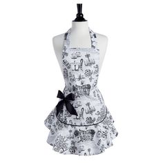 a mannequin wearing an apron with black bow on the front and white background