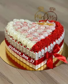 a heart shaped cake with roses on top