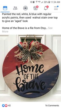 a red, white and blue wooden sign that says home of the brave on it