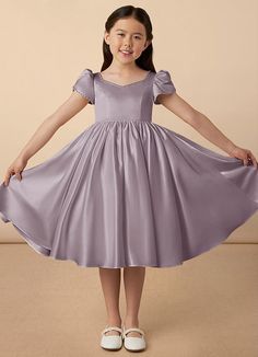 Juno is our sweet and classy matte satin dress. She features adorable puff sleeves, a sweetheart neckline, a A-line skirt, and a beautiful bow at the back of the dress. Satin Flower Girl Dresses, Frock Models, Short A Line Dress, Party Dress Classy, Xmas Dress, Satin Flower Girl Dress, Aesthetic Galaxy, Cute Dresses For Party, Kids Party Dresses