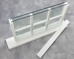 a glass display case sitting on top of a cement floor