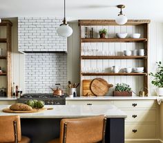 two brown chairs sitting on top of a kitchen counter