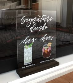 there is a sign in the window that says, signature drinks and hors d'oeuvres