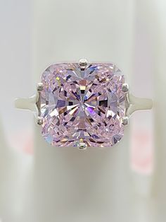 Pink Diamond Cut Diamond Ring, Luxury Pink Cubic Zirconia Wedding Jewelry, Pink Diamond Rings With Diamond Cut, Pink Cushion Cut Diamond Ring For Formal Occasions, Pink Moissanite Jewelry With Prong Setting, Dazzling Pink Brilliant Cut Diamond Ring, Pink Brilliant Cut Diamond Ring, Pink Diamond Ring With Fine Jewelry Style, Pink Diamond Ring With Diamond Accents For Wedding