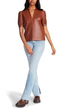 With its charming puff sleeves and tough faux-leather design, this chic top makes sure you achieve the perfect mix of sweet and edgy. 23 1/2" length (size Medium) Split neck Short sleeves 100% polyurethane Spot clean Imported Faux Leather Top, Chic Top, Leather Design, Leather Top, Puff Sleeves, Cognac, Steve Madden, Puff Sleeve, Split