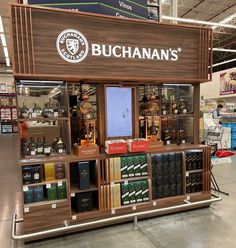 a display in a store filled with lots of bottles and shelves full of liquors