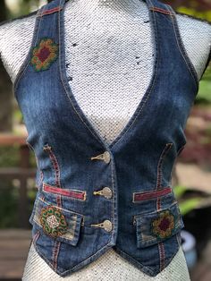 "This one of a kind hand painted upcycled jean vest is embellished with textiles from Thailand. The hand painted panels are done by a local artist and make for a unique piece that can be dressed up or down and worn for any occasion.  This is a stretchy denim and the vest is waist length and fits the body nicely Size S Length: 15\" back 19\" front Width: 14\" under arm tapering  to 12\" waist" Jeans To Vest Diy, Denim Vest Upcycle, Denim Vest Embroidery, Denim Vest Diy, Fitted Retro Denim Vest, Retro Fitted Denim Vest, Fitted Vintage Denim Blue Denim Vest