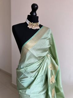 Introducing our exquisite new addition from the  T U S S A R collection: a delicately woven tussar silk saree, luxuriously soft to the touch. Unlike typical tissue, this fabric drapes effortlessly and forms elegant pleats with ease. Its subtle sheen and refined lustre are perfectly complemented by a copper border.  *Available in other colours Chanderi Saree With Unstitched Blouse In Pista Green, Pista Green Unstitched Tussar Silk Traditional Wear, Pista Green Chanderi Saree With Unstitched Blouse, Pista Green Tussar Silk Blouse Piece With Pallu, Designer Pista Green Tussar Silk Traditional Wear, Pista Green Handloom Saree With Traditional Drape, Designer Tussar Silk Blouse Piece In Pista Green, Pista Green Tussar Silk Blouse Piece In Traditional Drape, Pista Green Handloom Raw Silk Traditional Wear