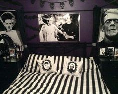 a bedroom decorated in black and white with pictures on the wall