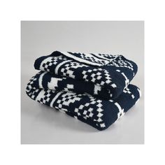 two black and white towels stacked on top of each other