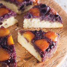 slices of cake with fruit toppings on a wooden plate