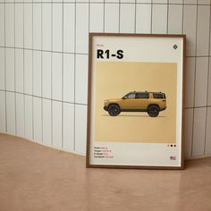 a yellow car is shown in front of a white tile wall with the words r1 - s on it