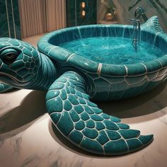 a large turtle shaped bathtub in the shape of a turtle