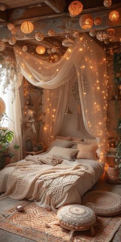 a bedroom decorated in white with fairy lights