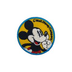 a mickey mouse patch on a white background