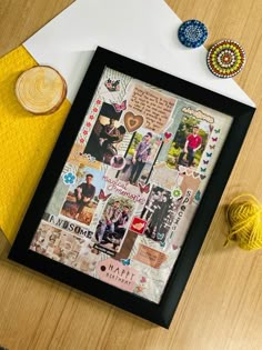 a wooden table topped with pictures and yarn